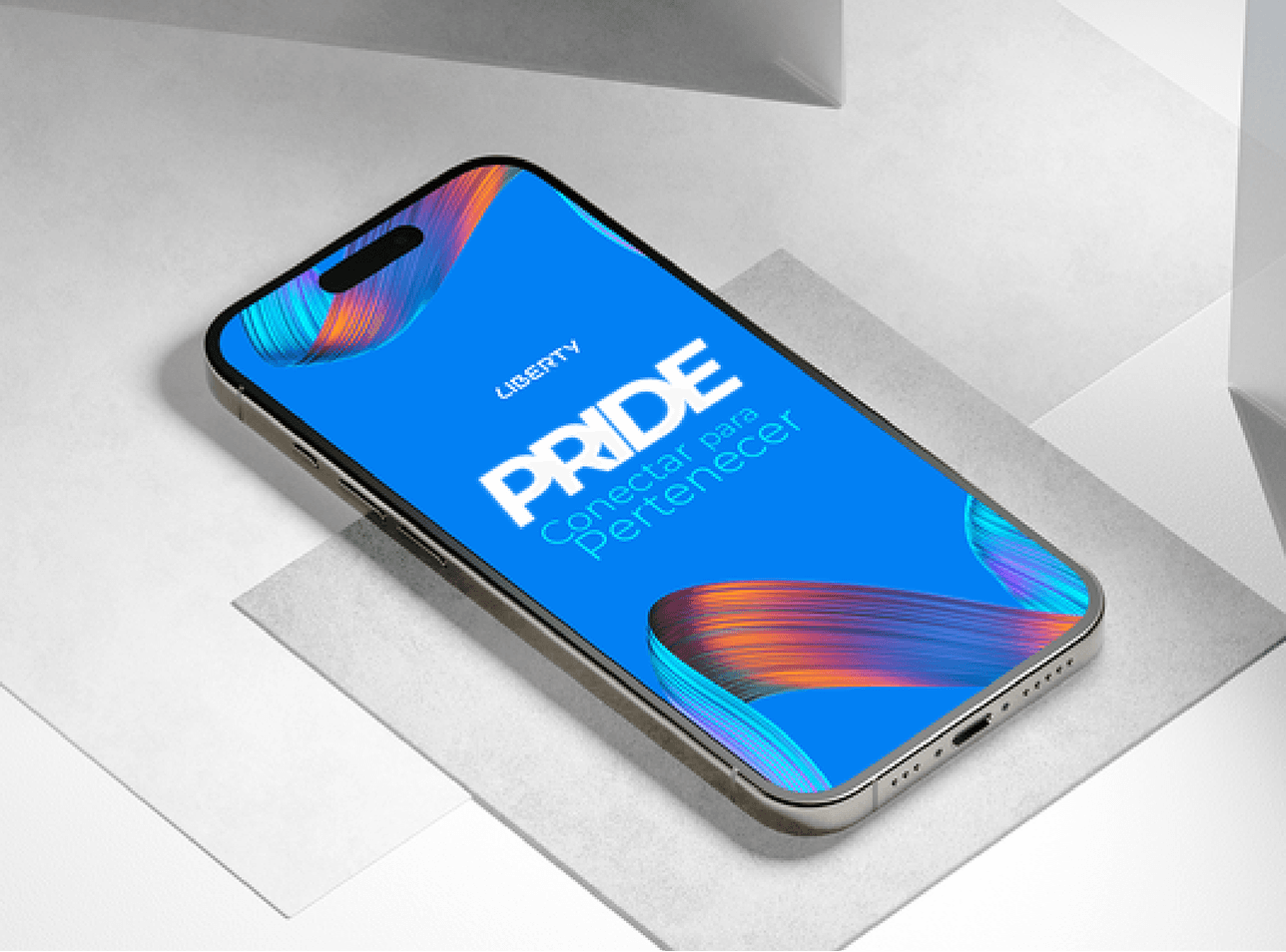 Smartphone mockup showing Liberty Pride artwork with multicolor ribbons on blue.