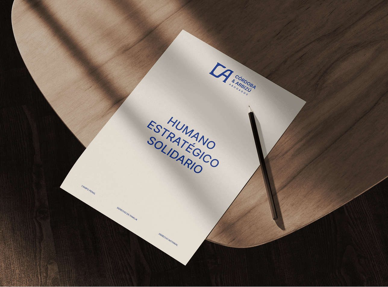 mockup of the brand showing a branded A4 and a pencil