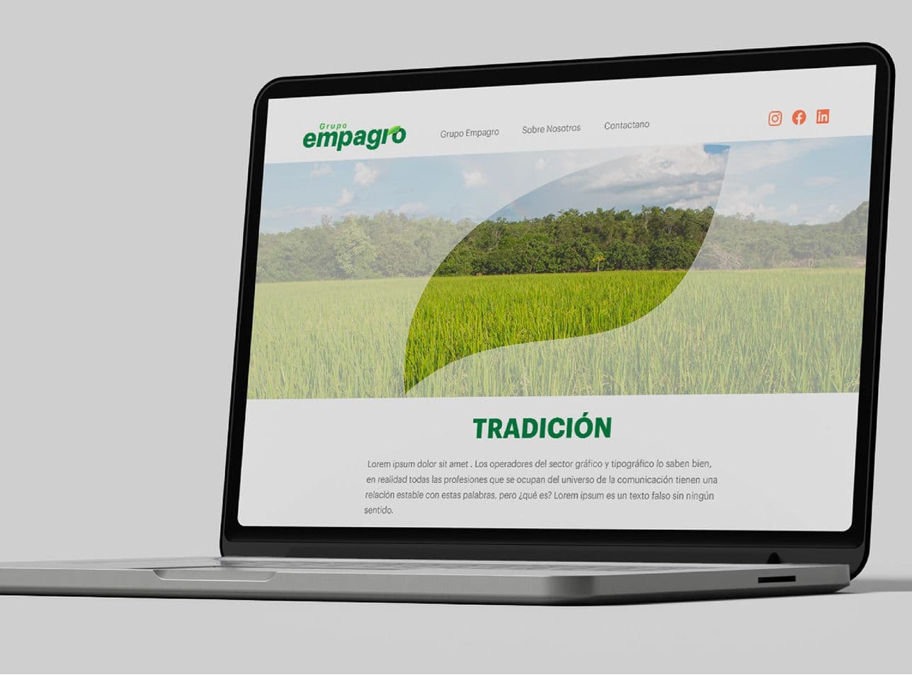 Grupo Empagro website mockup on a laptop, with crop photography and a large leaf motif.