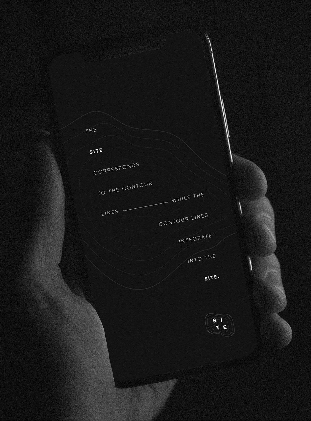 a hand holding a phone with site logo and an inspirational quote