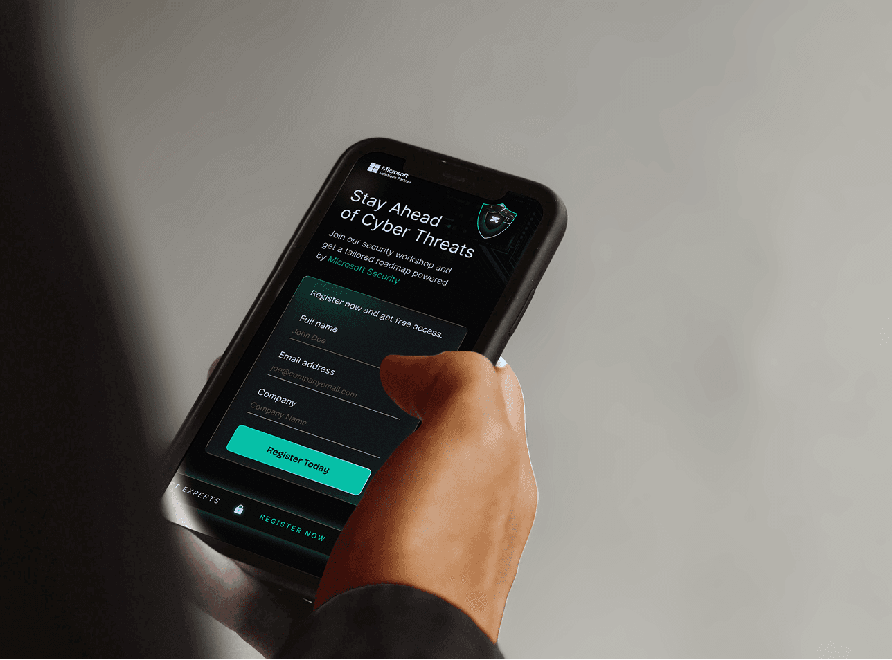Mockup showing a person holding a mobile, Landing page of a MSFT Partner
