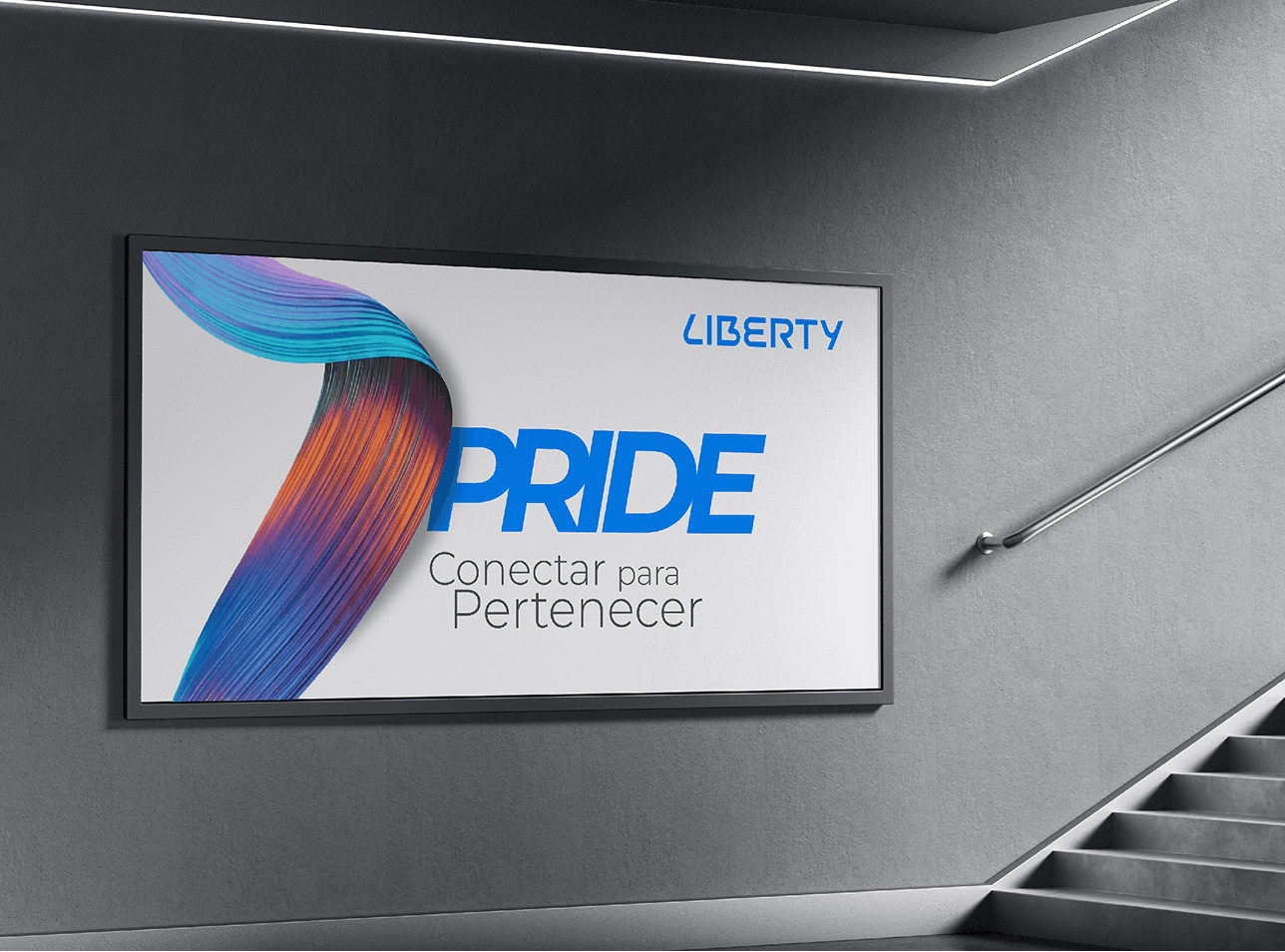 Liberty Pride wall poster beside a staircase, with a multicolor ribbon and campaign tagline.