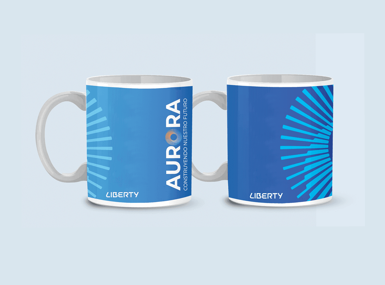Two Liberty Aurora mugs featuring blue radial graphics and the campaign wordmark.